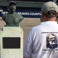 Admiring the bust of Hank Aaron.